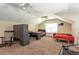 Spacious bedroom with twin beds, built-in desk, carpeted floors and bright natural light at 10 Foxhunter Flt, Ormond Beach, FL 32174