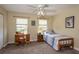 Inviting bedroom with desk, ample natural light from two windows, and soft neutral tones at 10 Foxhunter Flt, Ormond Beach, FL 32174