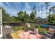 Back deck with stylish outdoor furniture and a view of the backyard and swimming pool at 10 Foxhunter Flt, Ormond Beach, FL 32174