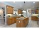 Spacious kitchen with granite countertops, island, and ample cabinetry at 10 Foxhunter Flt, Ormond Beach, FL 32174