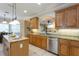 The gourmet kitchen has granite counters, stainless appliances, and an open design to enjoy while cooking and entertaining at 10 Foxhunter Flt, Ormond Beach, FL 32174