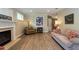 Cozy living room featuring fireplace, wood flooring, and neutral-toned furniture at 10 Foxhunter Flt, Ormond Beach, FL 32174