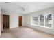 Spacious bedroom featuring neutral tones, ceiling fan, and ample natural light, creating a peaceful retreat at 101 Grand Plaza Dr # G30, Orange City, FL 32763