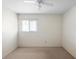 Neutral bedroom with carpeted floors, a ceiling fan, and a window with horizontal blinds at 101 Grand Plaza Dr # G30, Orange City, FL 32763