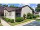 Exterior of the property featuring manicured landscaping and assigned parking at 101 Grand Plaza Dr # G30, Orange City, FL 32763