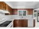 Cozy kitchen boasts bright countertops, wood cabinets, and modern appliances, creating a warm and inviting space at 101 Grand Plaza Dr # G30, Orange City, FL 32763