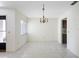 Bright living area with neutral tile flooring, chandelier, and a window that allows ample natural light at 101 Grand Plaza Dr # G30, Orange City, FL 32763