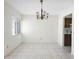 Bright living area with neutral tile flooring, chandelier, and a window that allows ample natural light at 101 Grand Plaza Dr # G30, Orange City, FL 32763