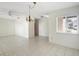 Bright living space features tile flooring, ceiling fans, and ample natural light from sliding glass doors at 101 Grand Plaza Dr # G30, Orange City, FL 32763