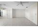 The living room with tile flooring, ceiling fan, a white door and window letting in light to create a welcoming space at 101 Grand Plaza Dr # G30, Orange City, FL 32763