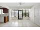 Bright sunroom featuring tile floors, ceiling fan, and sliding glass door for seamless indoor-outdoor living at 101 Grand Plaza Dr # G30, Orange City, FL 32763