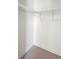 Organized walk-in closet with metal shelving for efficient storage of clothing and accessories at 101 Grand Plaza Dr # G30, Orange City, FL 32763