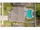 Aerial view of backyard oasis featuring a pool, patio and well-maintained landscaping at 1020 Hornbeam St, Oviedo, FL 32765
