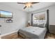 Comfortable bedroom with hardwood floors, ceiling fan, and plenty of natural light at 1020 Hornbeam St, Oviedo, FL 32765