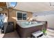 Backyard hot tub with sun shade, privacy fence and seating at 1020 Hornbeam St, Oviedo, FL 32765