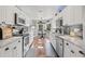 Bright, modern kitchen featuring white cabinets, stainless steel appliances, and a cozy breakfast nook at 1020 Hornbeam St, Oviedo, FL 32765