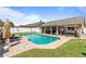 Backyard pool with grass surround, patio and a privacy fence at 1020 Hornbeam St, Oviedo, FL 32765