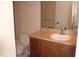 Bathroom with vanity, sink, and toilet showcasing a functional and well-kept space at 1083 S Hiawassee Rd # 611, Orlando, FL 32835