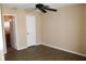 Bedroom featuring ceiling fan, wood floors and closet, offering comfortable living space at 1083 S Hiawassee Rd # 611, Orlando, FL 32835