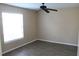 This bedroom has light-filled windows, vinyl floors, and a ceiling fan at 1083 S Hiawassee Rd # 611, Orlando, FL 32835