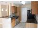 A modern kitchen featuring stainless steel appliances, granite counters, and an eat-in breakfast bar at 1083 S Hiawassee Rd # 611, Orlando, FL 32835