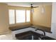 Kitchen nook with counter seating, pendant lights, tile floors, and a large window overlooking the property at 1083 S Hiawassee Rd # 611, Orlando, FL 32835