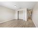 Spacious bedroom with vinyl floors, closet, and multiple doorways for easy access at 109 Bel Fiore Cv, Sanford, FL 32773