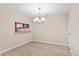 Light-filled dining room features modern vinyl floors and a view to the kitchen at 109 Bel Fiore Cv, Sanford, FL 32773