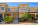 Inviting two-story townhouse with manicured landscaping and covered porch entryway at 109 Bel Fiore Cv, Sanford, FL 32773