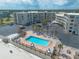 Beachfront complex aerial shot features a pool and surrounding palm trees at 1233 N Atlantic Ave # 3090, Daytona Beach, FL 32118
