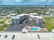 Aerial view showcasing a beachfront condo complex with a pool and parking at 1233 N Atlantic Ave # 3090, Daytona Beach, FL 32118