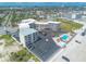 Aerial view showcasing a condo complex with beach access and nearby cityscape at 1233 N Atlantic Ave # 3090, Daytona Beach, FL 32118