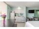 Charming kitchenette and dining area featuring updated appliances and ample natural light at 1233 N Atlantic Ave # 3090, Daytona Beach, FL 32118