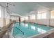 Indoor pool with natural light, stairs for easy entry, and ample space for recreation and exercise at 1233 N Atlantic Ave # 3090, Daytona Beach, FL 32118
