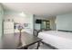 Well-lit studio features a modern kitchenette, queen bed, sleeper sofa, and stylish design at 1233 N Atlantic Ave # 3090, Daytona Beach, FL 32118