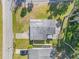 Aerial view of the home, showing the roof, driveway, backyard, and surrounding neighborhood at 128 Oakridge Ave, Edgewater, FL 32132