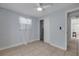Bedroom with tile flooring, a window with sheer curtains, and a closet for ample storage at 128 Oakridge Ave, Edgewater, FL 32132