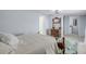 Bedroom with a bed, dresser, and access to laundry room and additional rooms at 128 Oakridge Ave, Edgewater, FL 32132