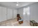 Bright bedroom with tile flooring, a ceiling fan, and natural light from the large window at 128 Oakridge Ave, Edgewater, FL 32132