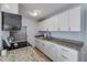 Well-lit kitchen boasts stainless appliances and granite countertops at 128 Oakridge Ave, Edgewater, FL 32132
