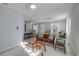 Bright open-concept living area seamlessly flowing into the dining space and kitchen at 128 Oakridge Ave, Edgewater, FL 32132