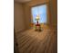 Bedroom featuring wood-look floors and a side table with lamp at 139 Crawl Key Ct, Deland, FL 32720