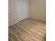 Empty bedroom showing wood look floors and a closet at 139 Crawl Key Ct, Deland, FL 32720