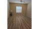 Bedroom with light-colored walls, a ceiling fan and neutral-toned wood-look flooring at 139 Crawl Key Ct, Deland, FL 32720