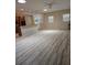 Open-concept living area with hardwood floors and lots of natural light at 139 Crawl Key Ct, Deland, FL 32720