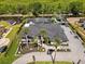 Stunning aerial view of a well-maintained home with a pool, backyard, and private access to the canal at 1446 Stone Trl, Enterprise, FL 32725