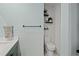 Stylish half-bathroom with white shiplap wall, sleek fixtures, built-in shelves and a neutral color scheme at 1446 Stone Trl, Enterprise, FL 32725