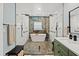 Bright and spacious main bathroom with double shower, soaking tub, double sinks, and stylish green vanity at 1446 Stone Trl, Enterprise, FL 32725