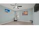 Calm bedroom features fan, window, and artwork at 1446 Stone Trl, Enterprise, FL 32725