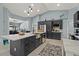 Bright kitchen featuring large island, stainless steel appliances, and ample cabinet space at 1446 Stone Trl, Enterprise, FL 32725